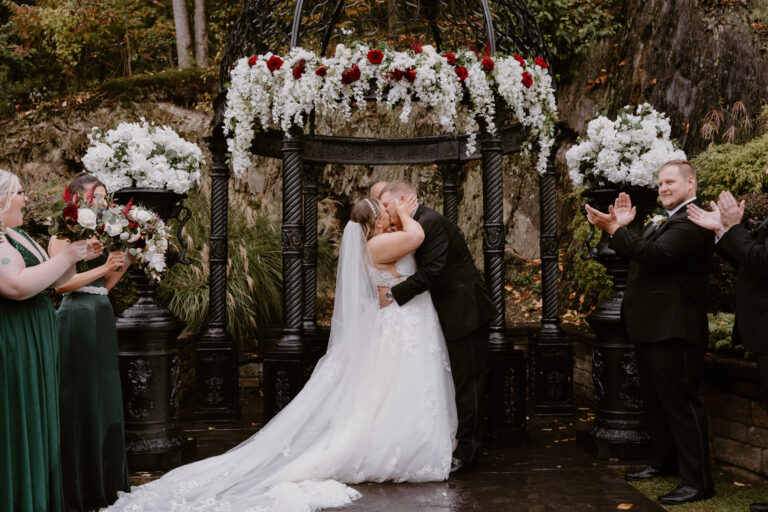 Bride and groom kiss in front of Terraview gazebo